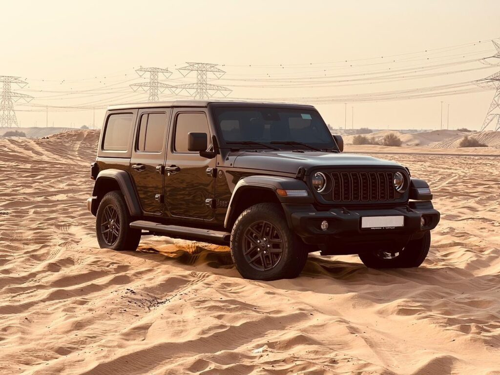 Side profile Jeep Wrangler for rent in Dubai desert-ready car