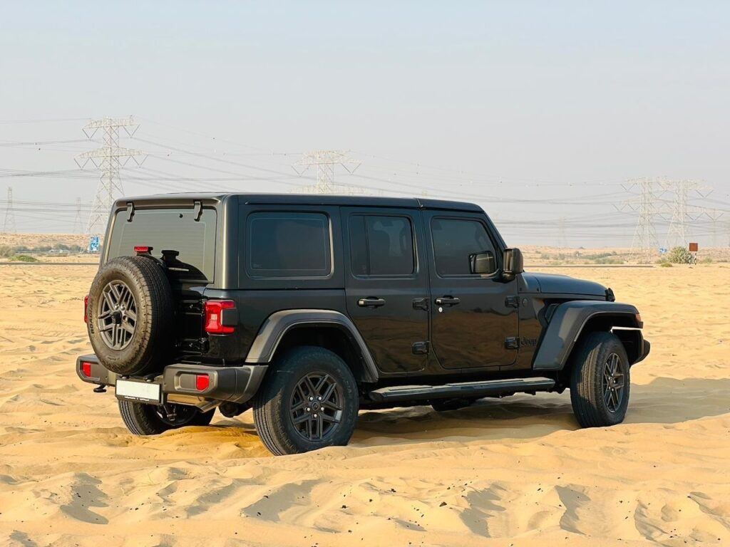 Side profile Jeep Wrangler for rent in Dubai desert-ready car