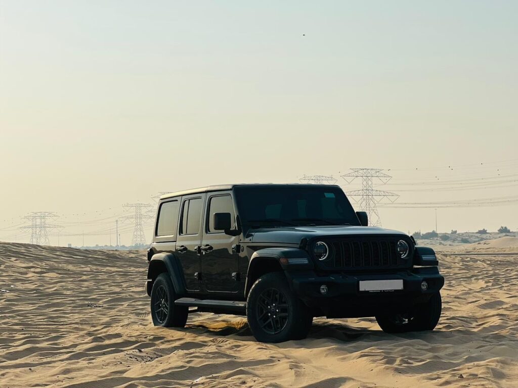 Side profile Jeep Wrangler for rent in Dubai desert-ready car
