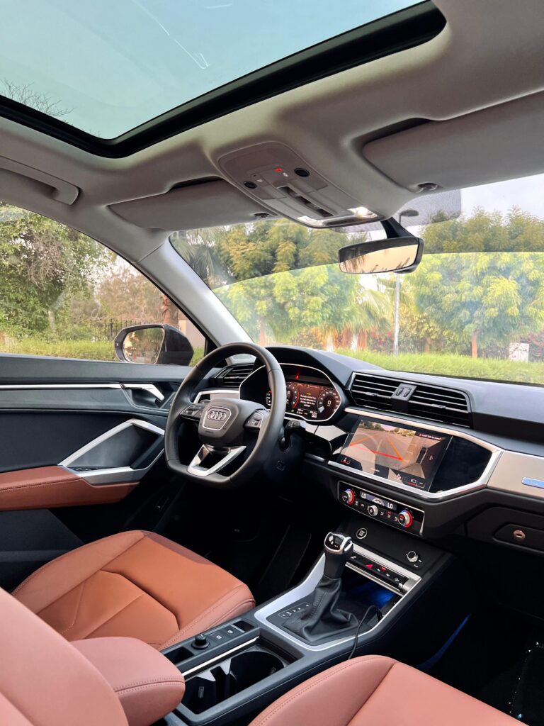 Audi Q3 interior with leather seats and panoramic sunroof