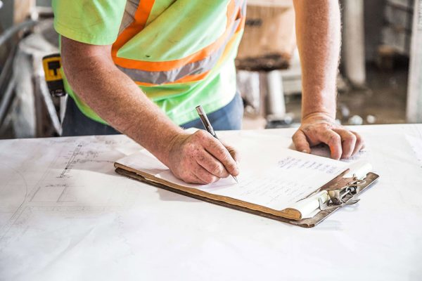 worker-filling-paperwork